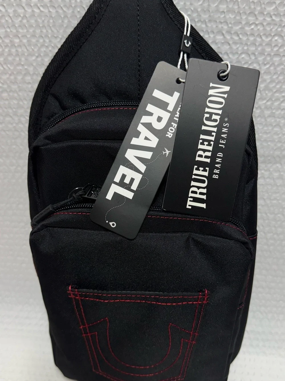 True religion travel sling black bag red horseshoe front